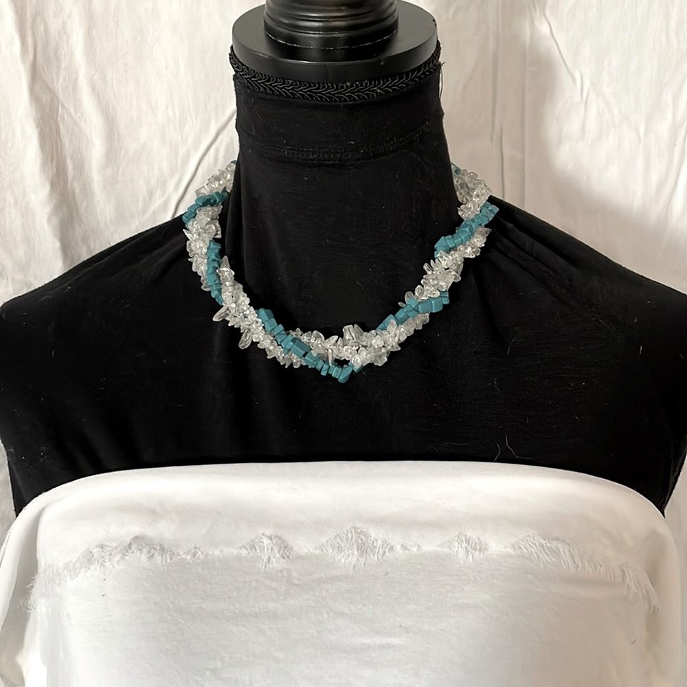 Chic strand twist turquoise + crystal theme. Lobster clasp/silver toned metal.